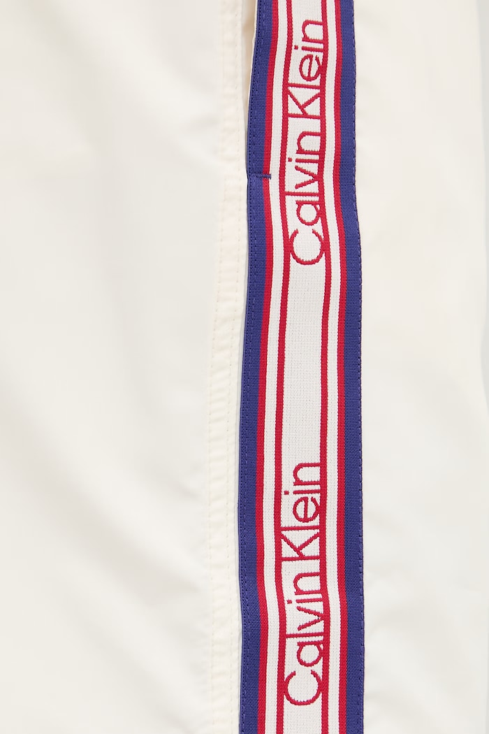 Calvin Klein plavecké šortky pánske béžová LV00N61042