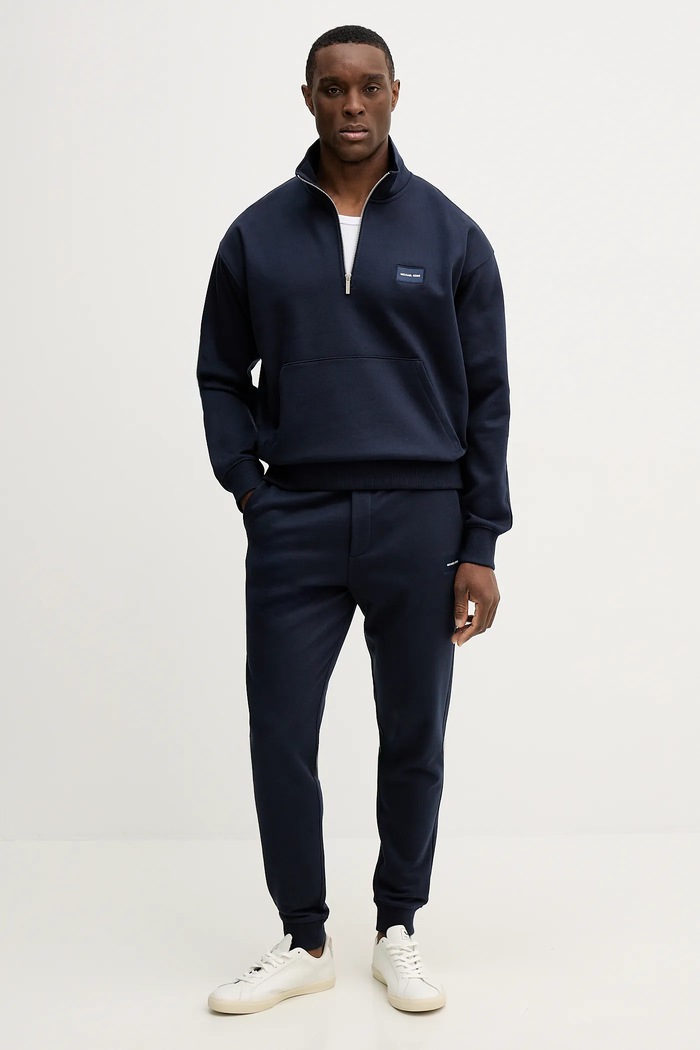 Bavlnené tepláky Michael Kors CR652VFHC4 tmavomodrá SS26