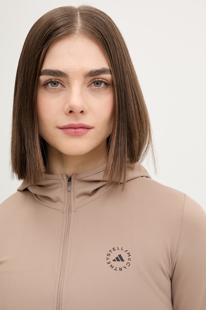 Pulover za vadbo adidas by Stella McCartney bež KF4033