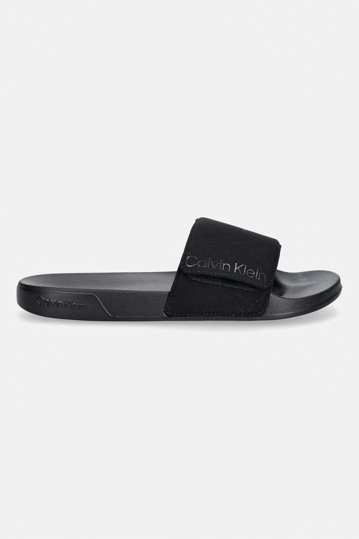 Calvin Klein šľapky s otvorenými prstami pánske ESS SLIDE ADJ MONOBRAND CV HM0HM02115 čierna SS26
