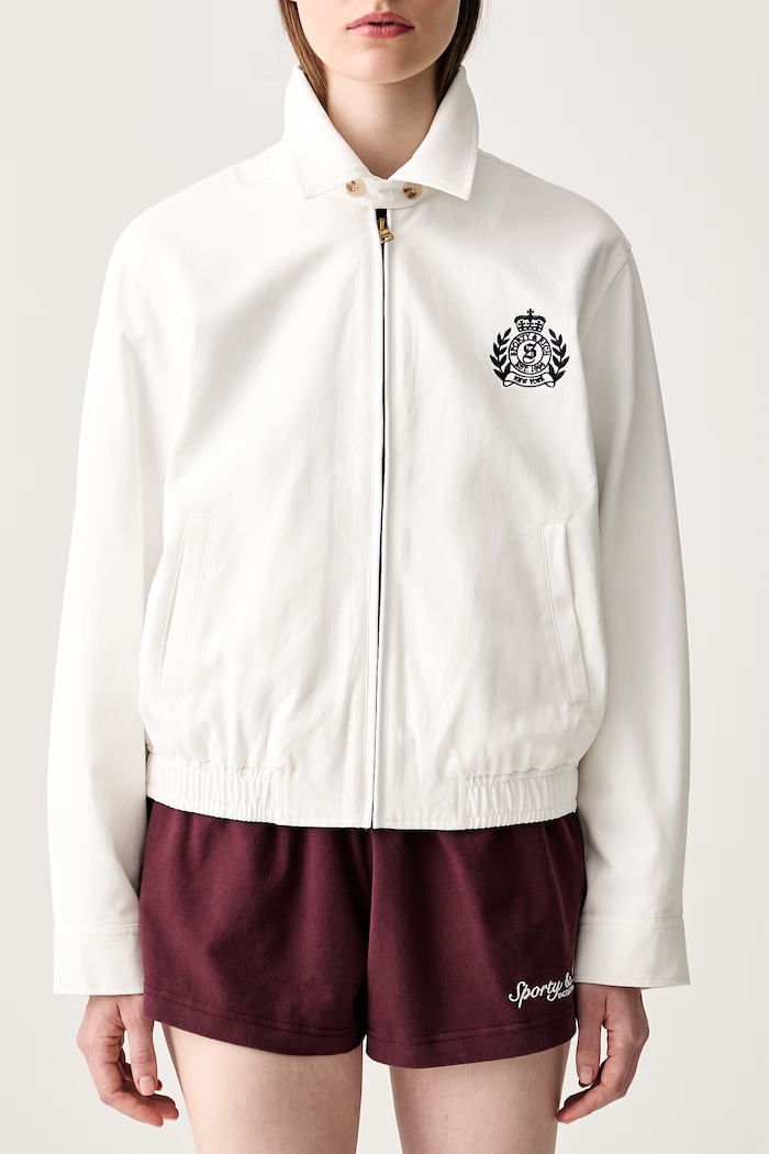Sporty & Rich NY Crest kratka jakna za žene od pamuka bijela OW02876243WH37