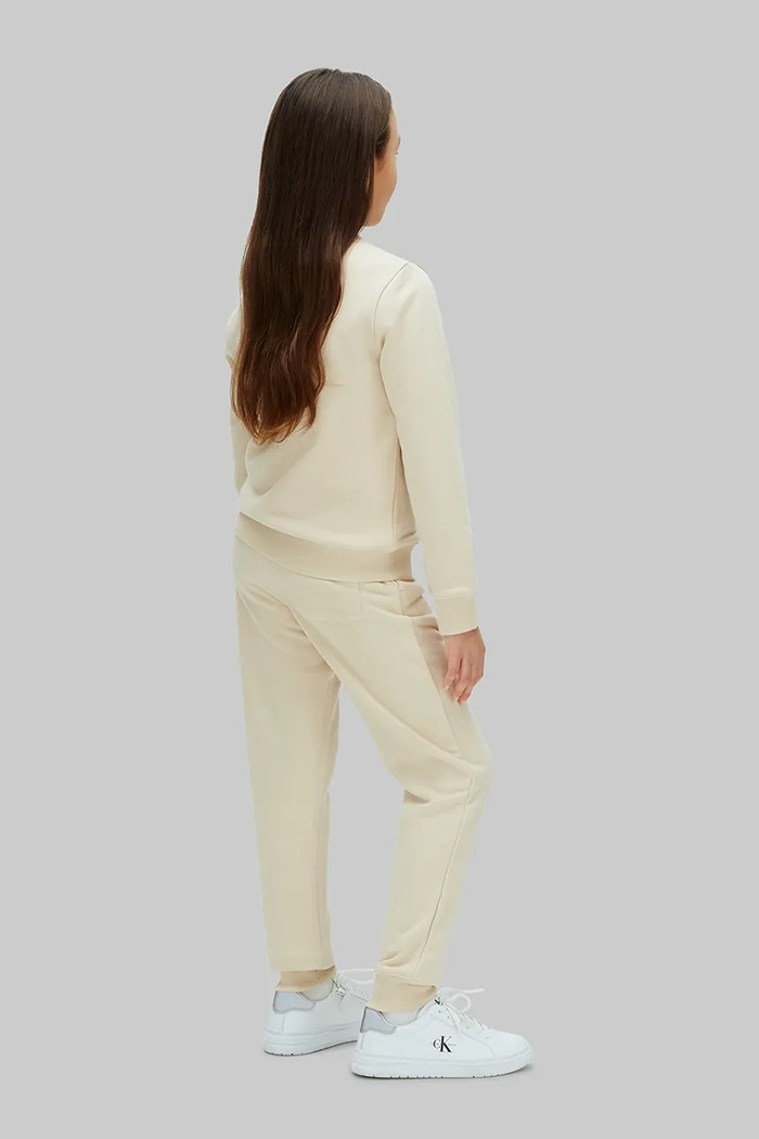 Calvin Klein Jeans teplákové nohavice detské s bavlnou béžová LV1CKSJC53.128.176.PPY2