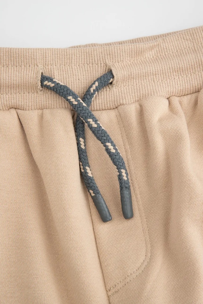 Băieți Coccodrillo Pantaloni de trening copii cu bumbac WC6120103NBK bej