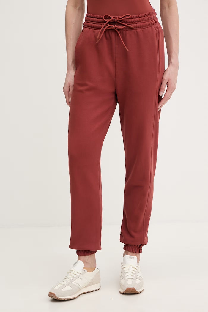 Bavlnené tepláky adidas by Stella McCartney bavlna oranžová JZ0660