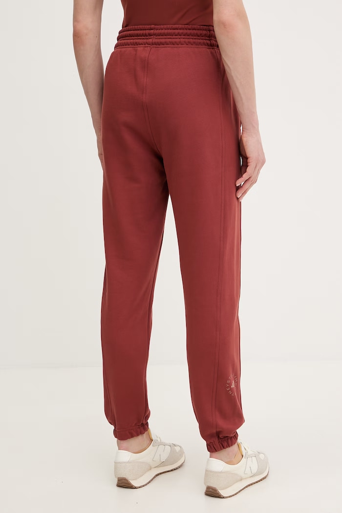 Oblečenie Bavlnené tepláky adidas by Stella McCartney JZ0660 oranžová