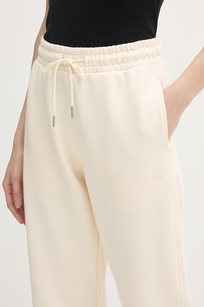 Calvin Klein Jeans teplákové nohavice dámske bavlnené béžová LV047F210G
