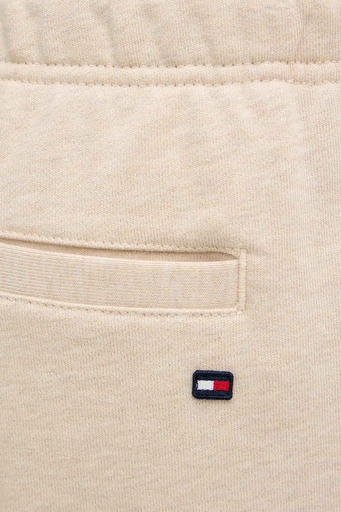 Bavlněné tepláky Tommy Hilfiger béžová MW0MW42537