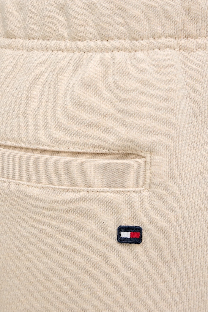 Bavlněné tepláky Tommy Hilfiger béžová MW0MW42537