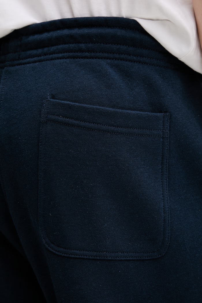 Tommy Jeans pantaloni de trening bărbați cu bumbac DM0DM23014 bleumarin