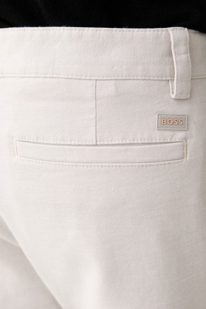 BOSS Orange spodnie chinos męskie bawełniane z elastanem Pleated beżowy 50559158