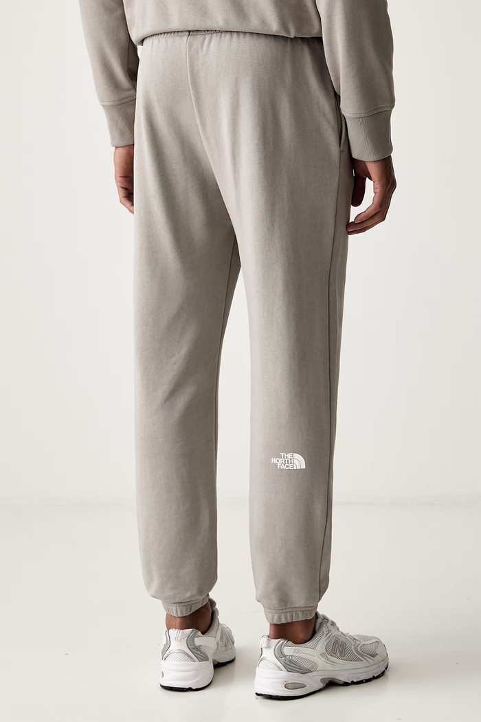 Odzież The North Face spodnie dresowe męskie z bawełną Simple Dome NF0A8C412MB1 szary