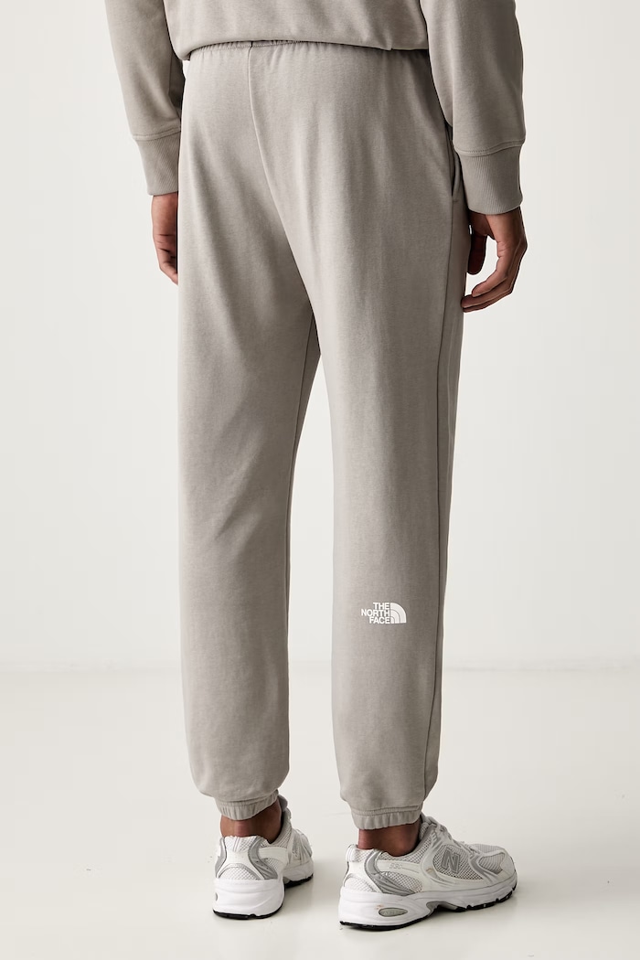 Odzież The North Face spodnie dresowe męskie z bawełną Simple Dome NF0A8C412MB1 szary