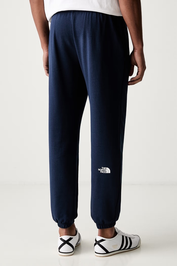 Odzież The North Face spodnie dresowe męskie z bawełną Simple Dome NF0A8C418K21 granatowy