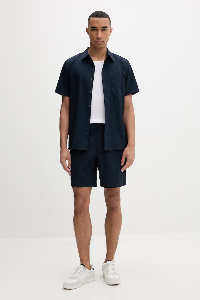 Calvin Klein šortky pánske LV04LF610G tmavomodrá SS26
