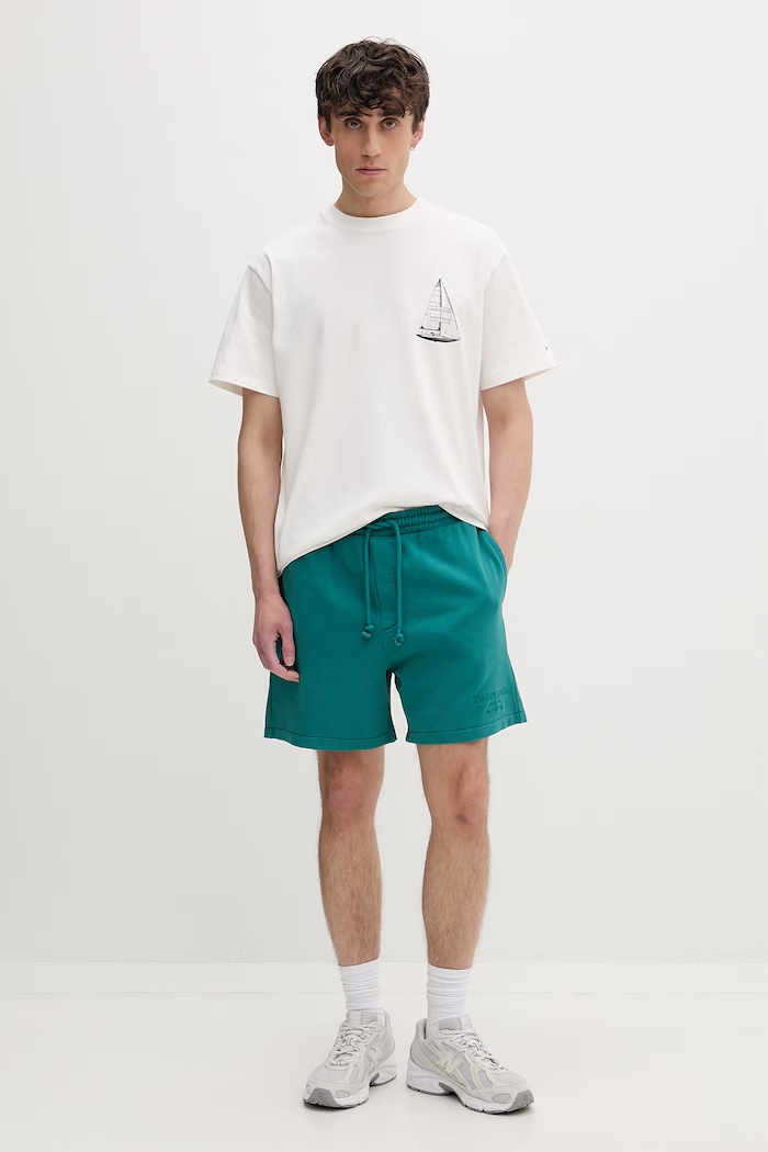 Tommy Jeans trenirka kratke hlače moške bombažne DM0DM22696 turkizna SS26