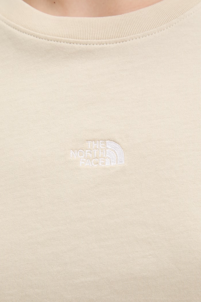 The North Face crop top ženski bombažen ESSENTIAL NF0A8GR1DOM1 bež
