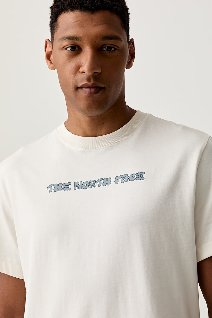 The North Face T-shirt męski bawełniany LOGO TWIST RELAXED beżowy NF0A8GQVQLI1