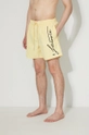 yellow Lacoste swim shorts