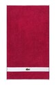 Μικρή βαμβακερή πετσέτα Lacoste LCASUAL Bigarreau 55 x 100 cm μωβ 1063379