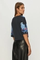 Desigual - T-shirt  100% lyocell Gondozási tippek:  mosógépben 30 fokon mosható, nem szárítható szárítógépben, fehérítővel nem kezelhető, közepes hőmérsékleten vasalni