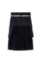 Παιδική φούστα DKNY  Φόδρα: 100% Βισκόζη Κύριο υλικό: 100% Πολυεστέρας Φινίρισμα: 6% Σπαντέξ, 94% Πολυεστέρας