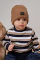 Дитяча шапка Jamiks  Основний матеріал: 80% Вовна мериноса, 20% Поліамід Підкладка: 95% Бавовна, 5% Еластан