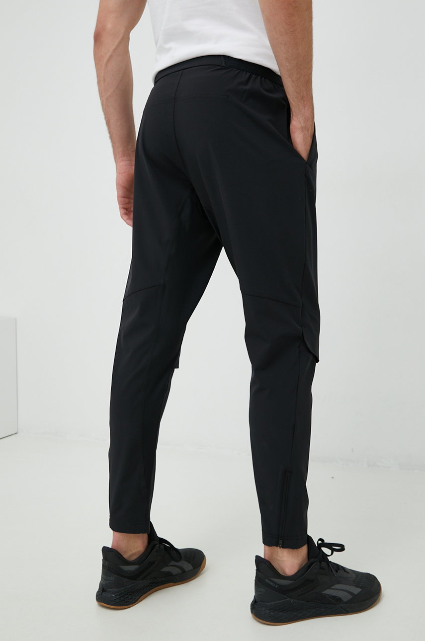 Reebok spodnie treningowe Materiał zasadniczy: 87 % Poliester, 13 % Elastan, Inne materiały: 88 % Poliester, 12 % Elastan, Podszewka kieszeni: 84 % Poliester, 16 % Elastan