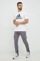 Tepláky adidas Performance fialová