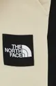 beżowy The North Face spodnie dresowe bawełniane