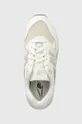 white New Balance sneakers 580