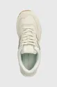 beige New Balance sneakers 574