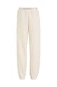 Calvin Klein Jeans spodnie dresowe dziecięce IB0IB01681.9BYX beżowy AW23
