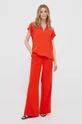Nohavice Calvin Klein oranžová