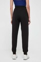 Odzież Puma spodnie dresowe bawełniane BETTER ESSENTIALS 675989 czarny