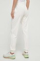 Odzież Guess spodnie dresowe COUTURE V3BB27.KBXI2 beżowy