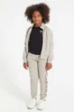 бежевий Дитячі спортивні штани Guess Для дівчаток