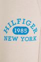 Detské tepláky Tommy Hilfiger béžová KG0KG07605.128.176.9BYX