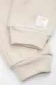 beżowy Coccodrillo spodnie dresowe niemowlęce