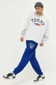 Bavlnené tepláky Tommy Jeans tmavomodrá