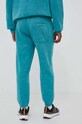 Odzież adidas spodnie dresowe IJ6931 turkusowy