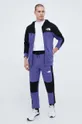 Бавовняні спортивні штани The North Face фіолетовий