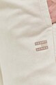 Хлопковые спортивные штаны Tommy Jeans бежевый DM0DM17779