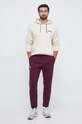 Under Armour spodnie dresowe 1379774 bordowy SS24