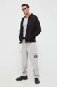 Nohavice Calvin Klein Jeans sivá