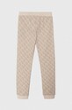 Detské bavlnené tepláky Guess J4YQ11.KA6R4.9BYH béžová AW24