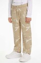 Дитячі бавовняні штани Calvin Klein Jeans TERRY JOGGER візерунок бежевий IB0IB02124.9BYH