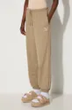 Bavlněné tepláky Puma Better Classics Sweatpants béžová 624234