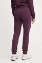 Odzież Puma spodnie dresowe bawełniane 676805 fioletowy