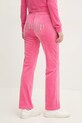 Odzież Juicy Couture spodnie dresowe welurowe TINA TRACK PANT JCAPW045.679 różowy