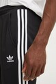 Tepláky adidas Originals Adicolor 70s Track Pant čierna IZ4807